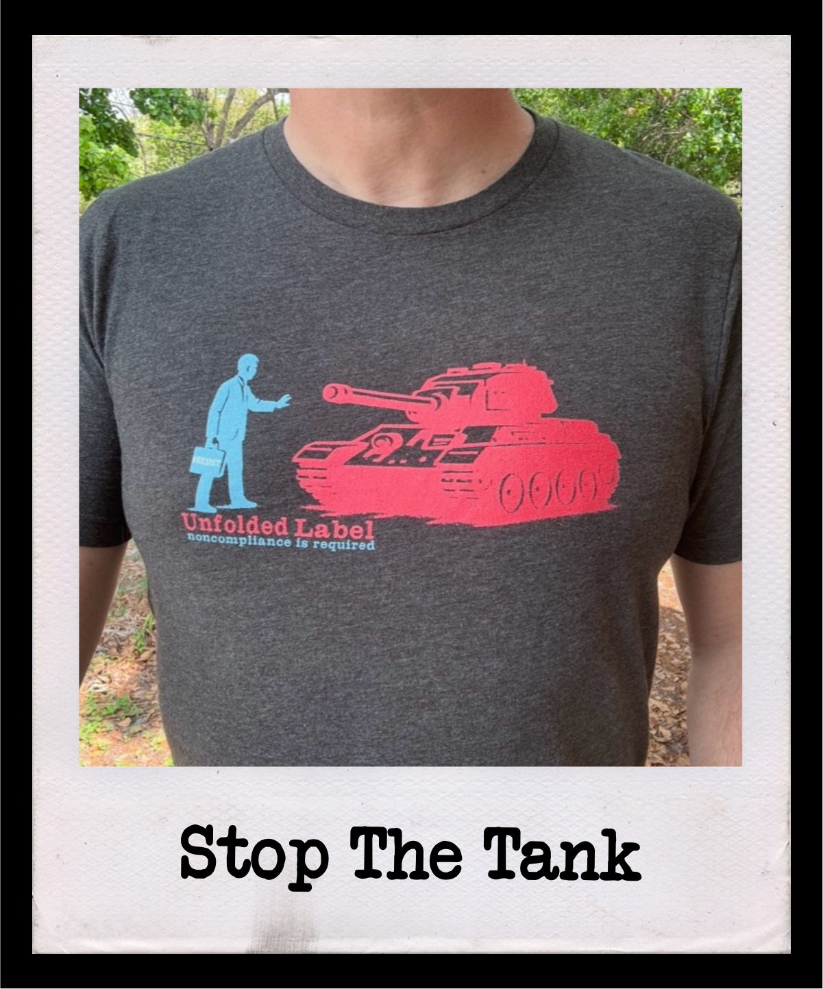 Stop The Tank anti-war protest t-shirt by Unfolded Label. Bold resistance clothing for peace advocates and activists. Artist-designed graphic tee available in multiple colors.