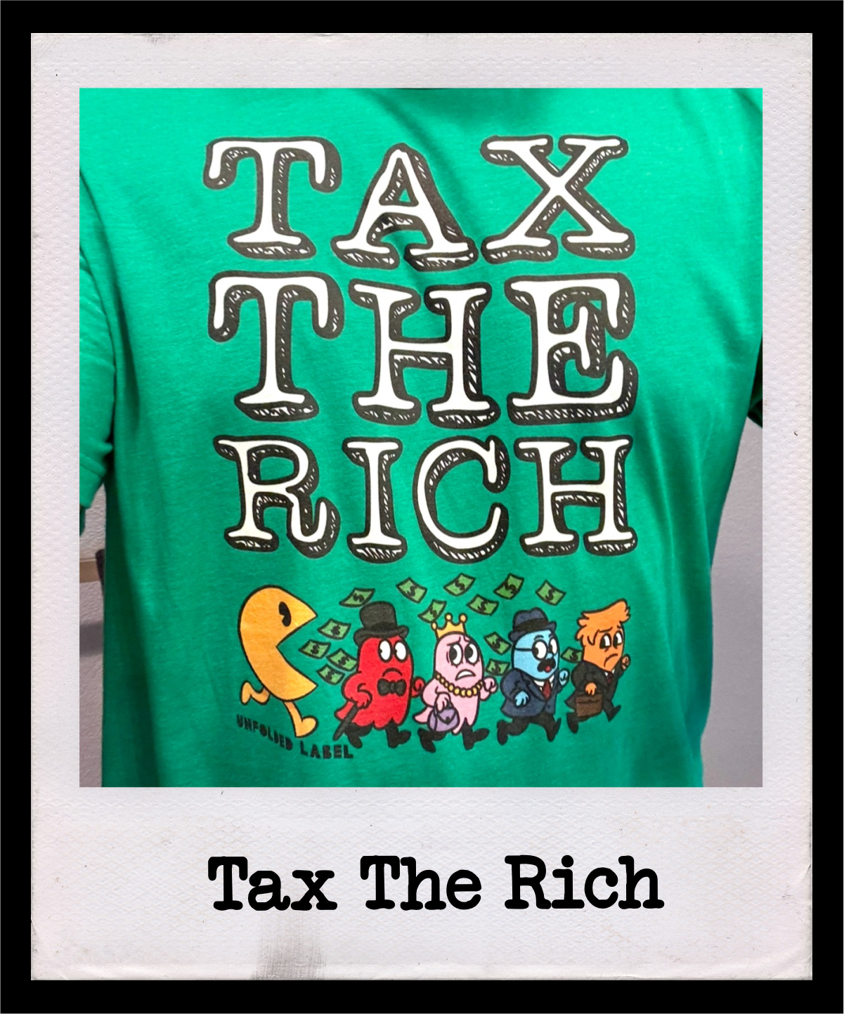 Tax The Rich progressive political t-shirt by Unfolded Label. Artist-designed economic justice graphic tee available in multiple colors for men, women & kids.