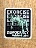 Sticker with text 'Exorcise Democracy' has the Statue of Liberty levitating by Unfolded Label