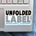 Sticker on a laptop with 'Unfolded Label Resistance Clothing' text. Protest brand.