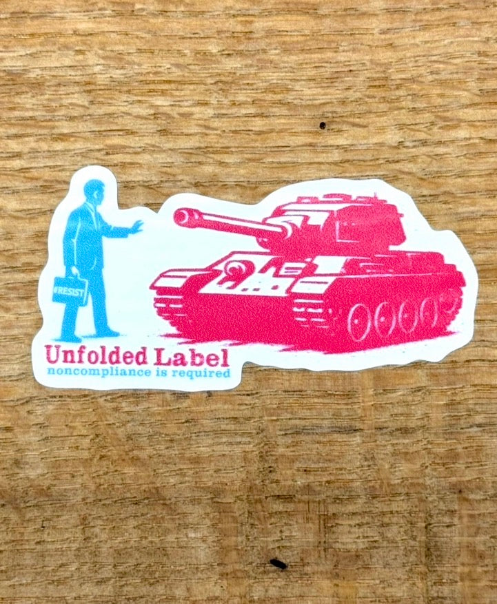 Protest ticker with a person standing up to a tank by Unfolded Label